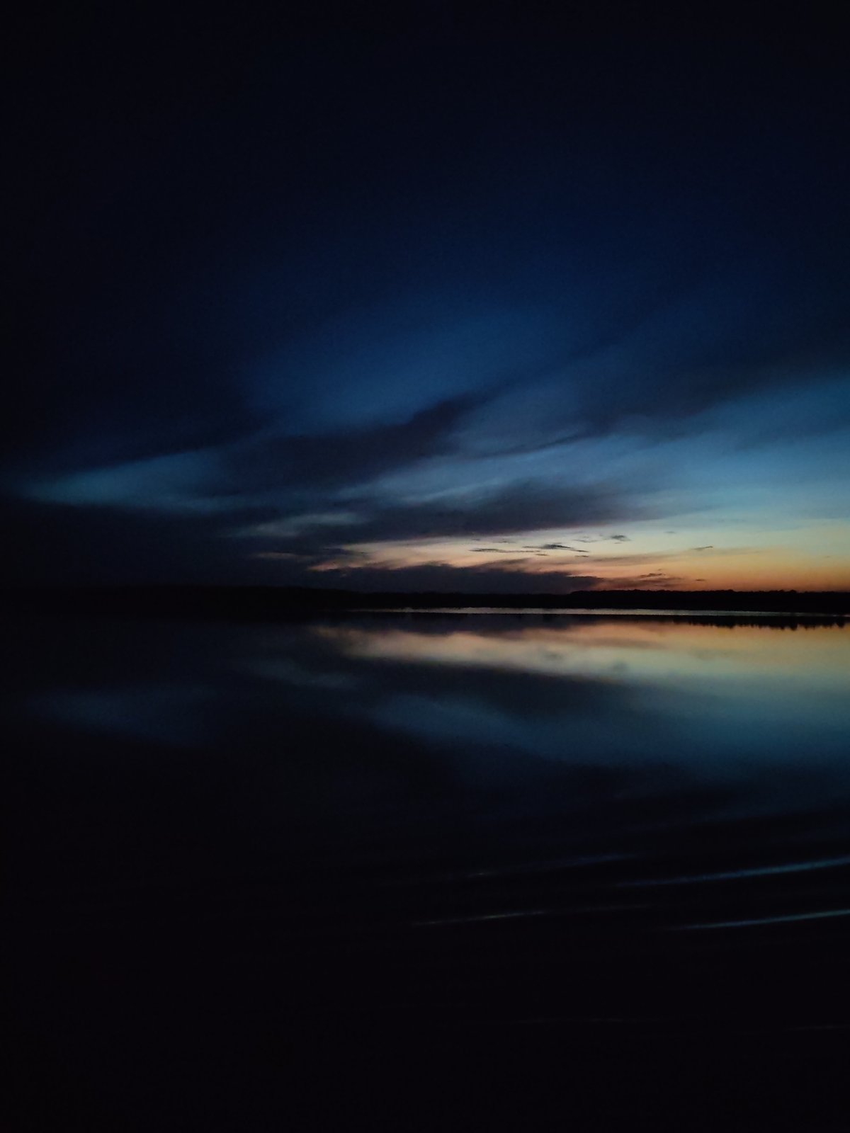 Twilight observed over water in Korcheva, Russia