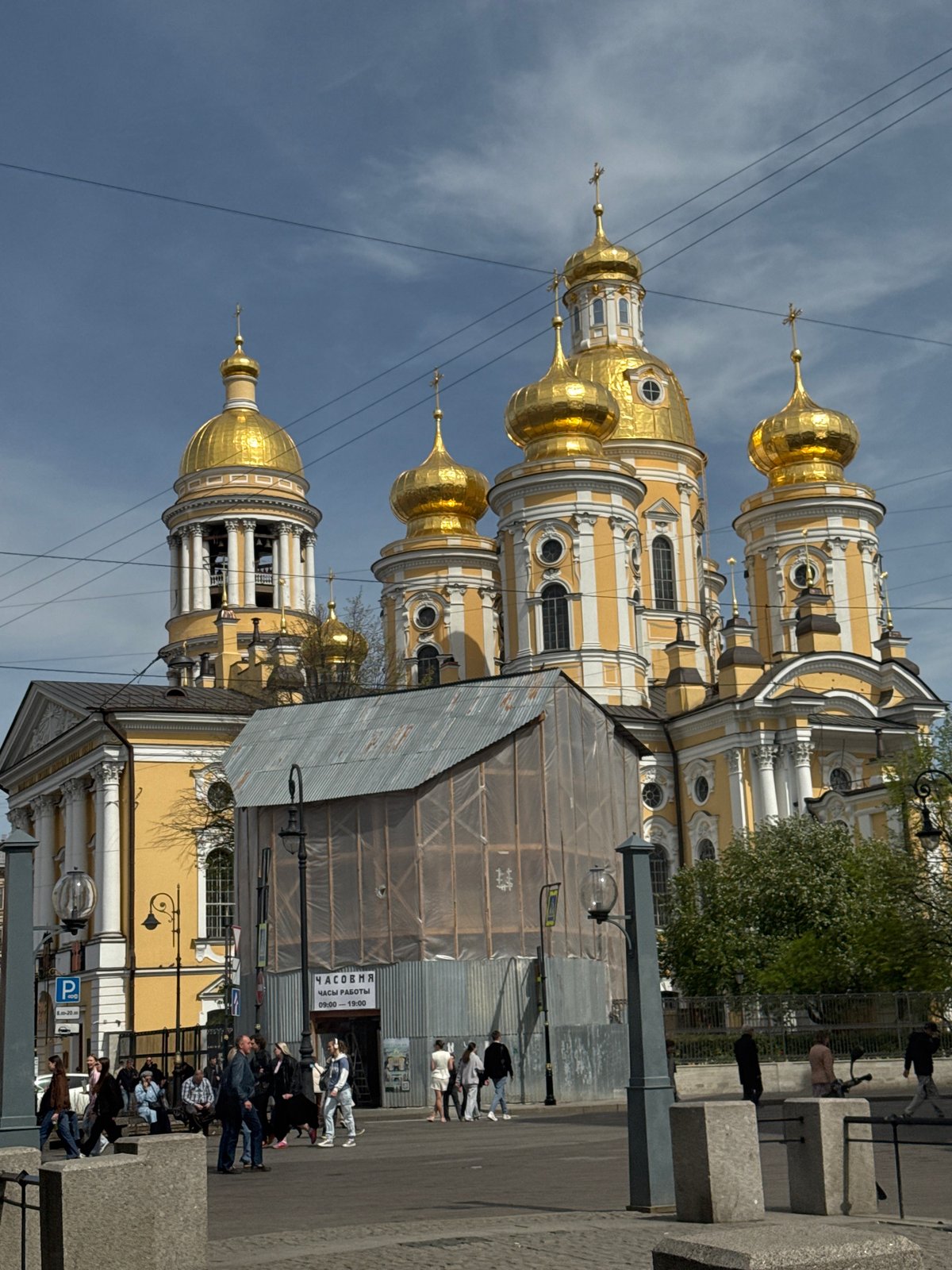 Morning street life captured near St. Petersburg's Naval Cathedral