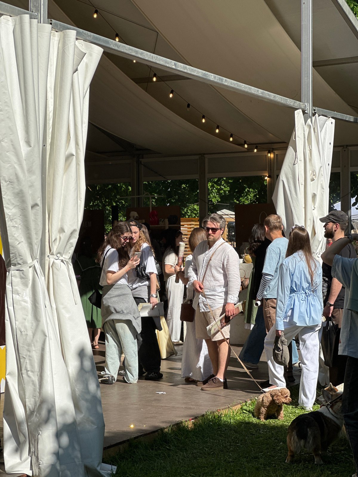 Moscow outdoor market scene captured with illuminated white tent