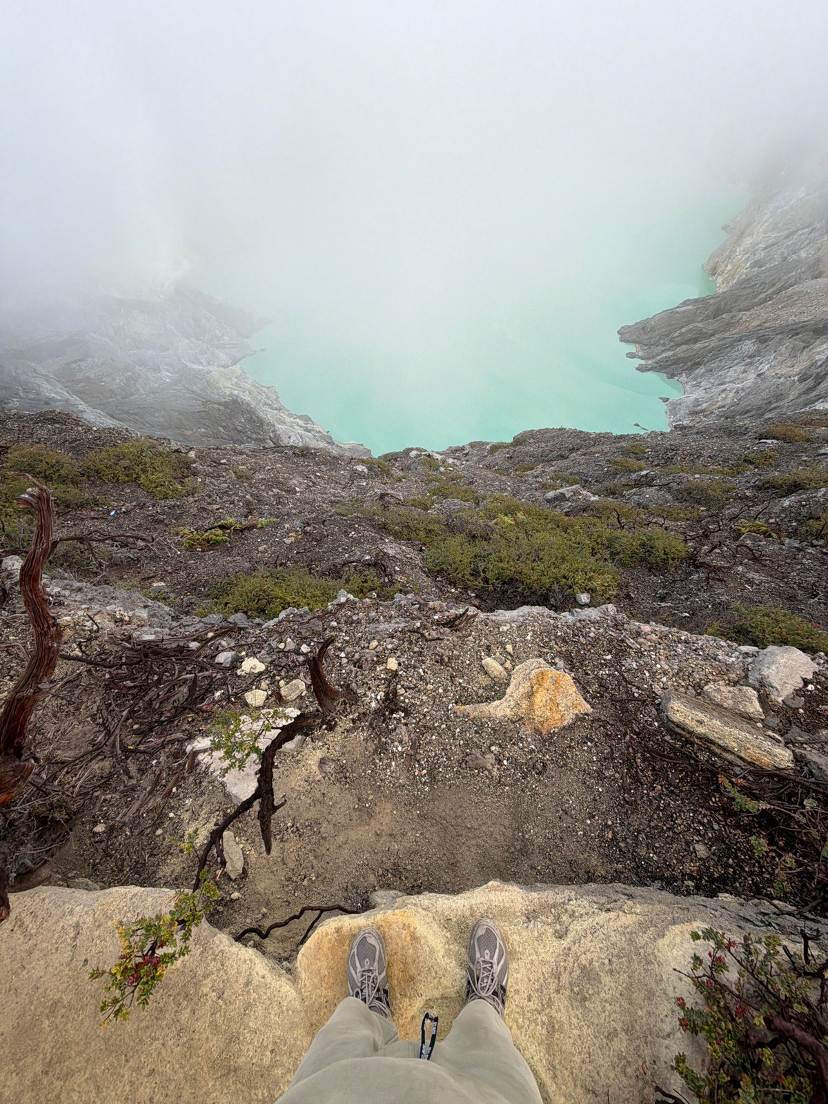 Crater rim visit at golden hour, turquoise lake and campfires below