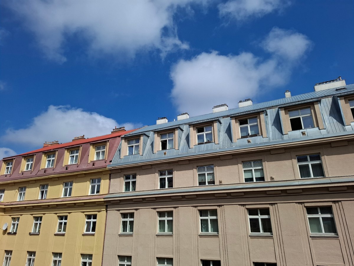 Morning street-level and rooftop views of a residential city block