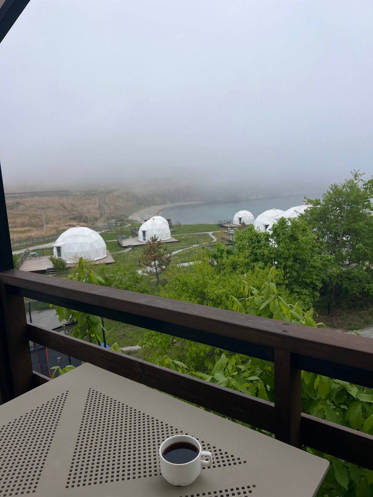 Morning balcony view captures domed structures in Zarubino, Russia