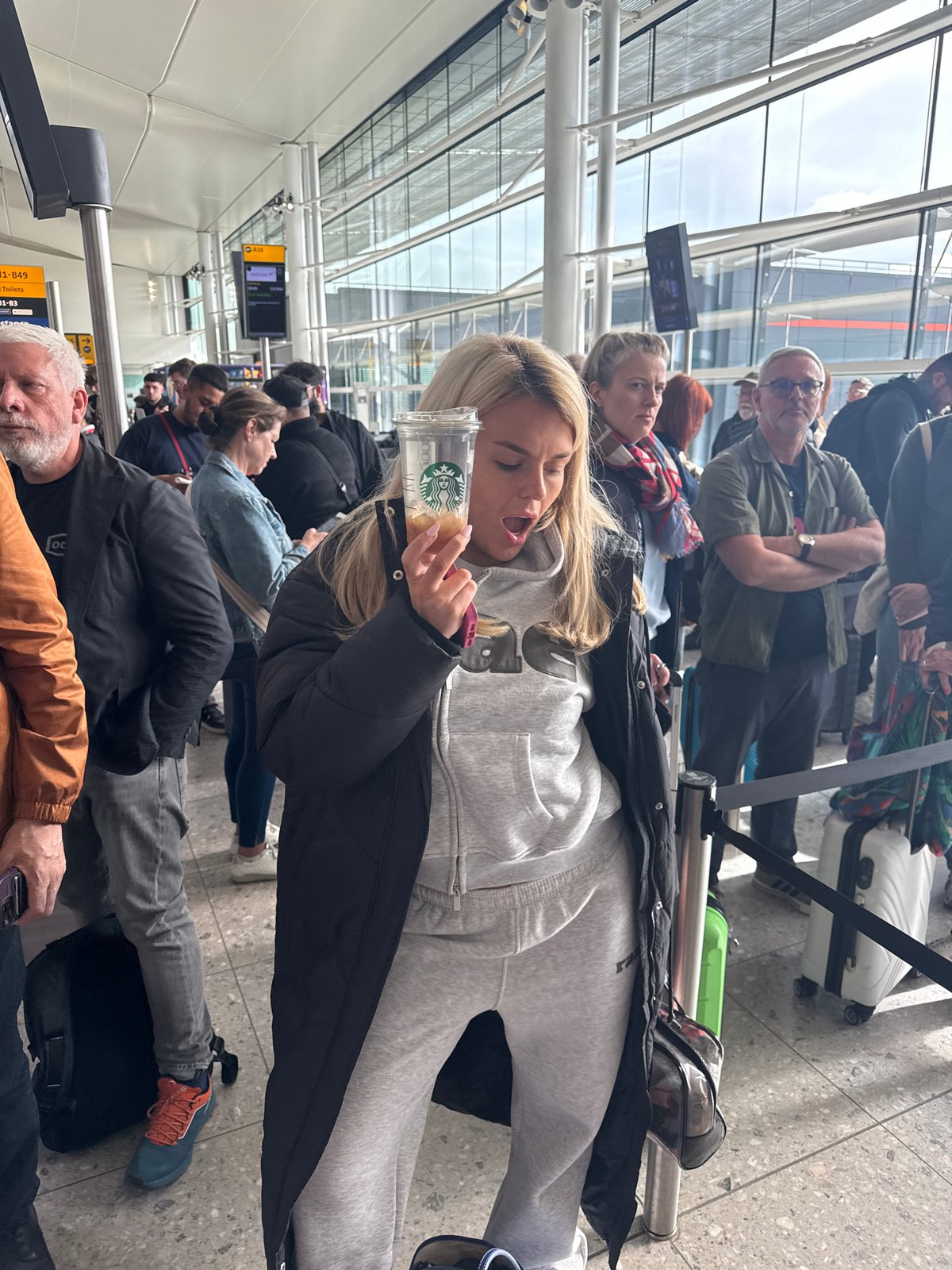 Morning boarding queue forms for Vienna flight at London airport