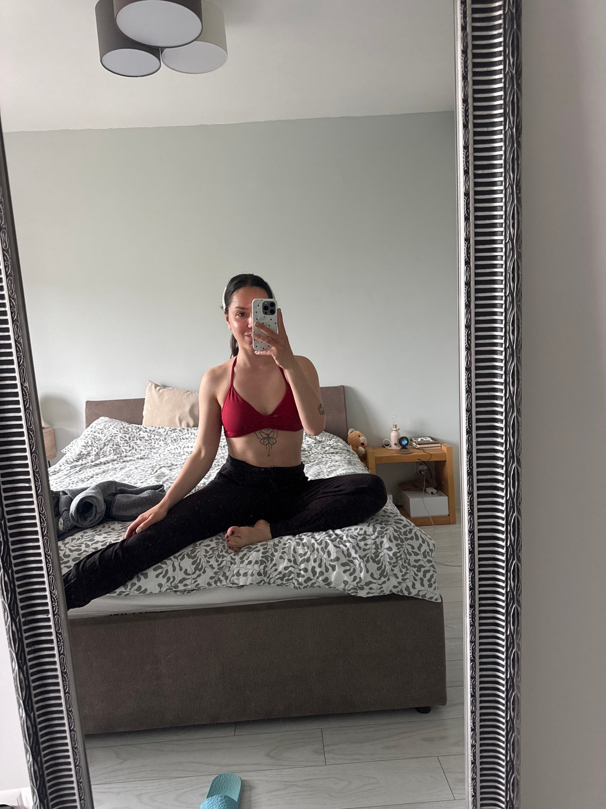 Woman takes playful mirror selfies in Burgas bedroom