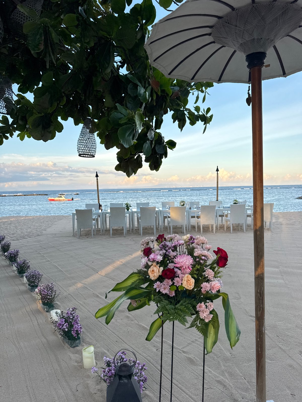 Beach wedding celebration captured at Indonesian coastal venue