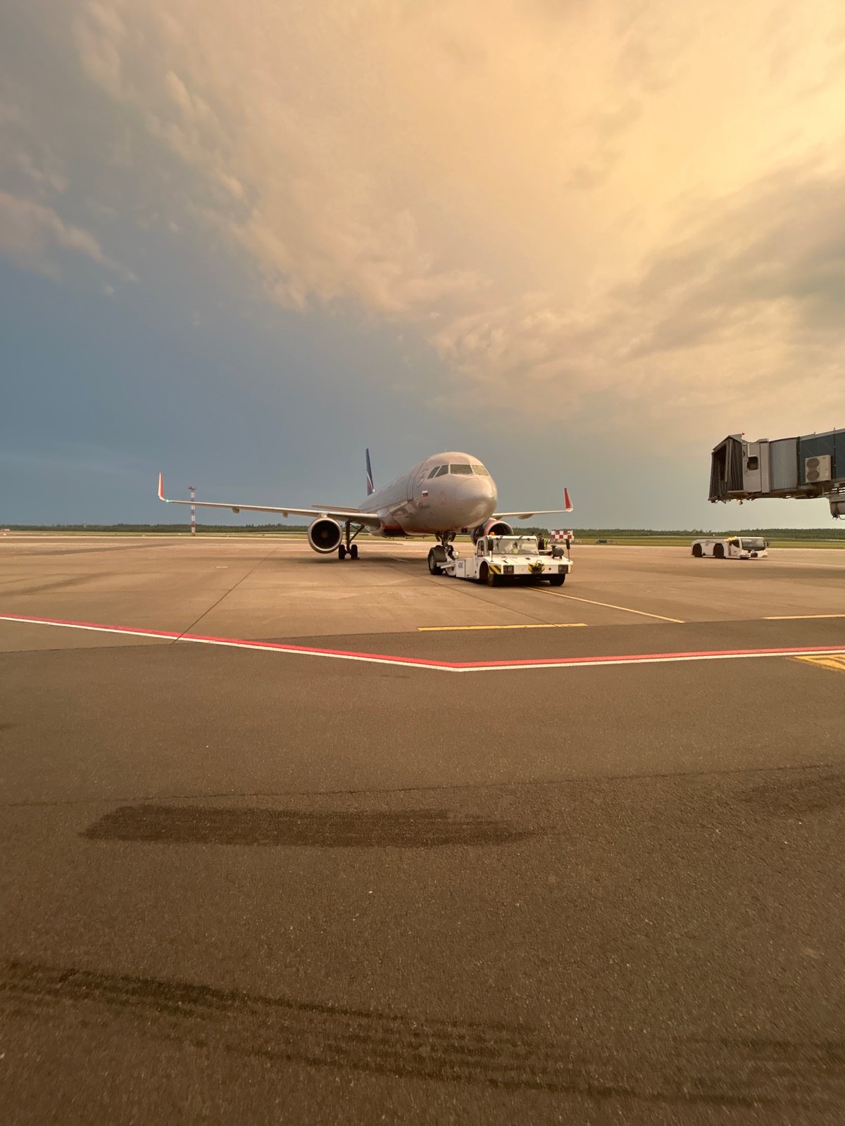 Aircraft towed at dusk on Minsk airport tarmac