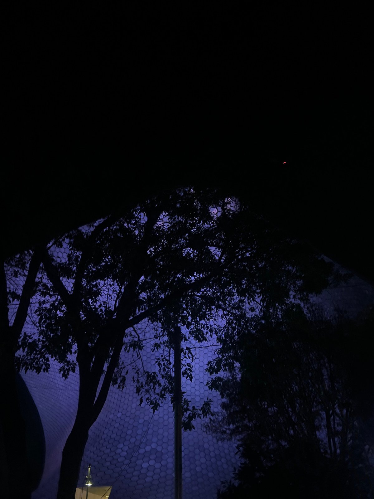 Illuminated hexagonal structure observed across Mexico City nighttime