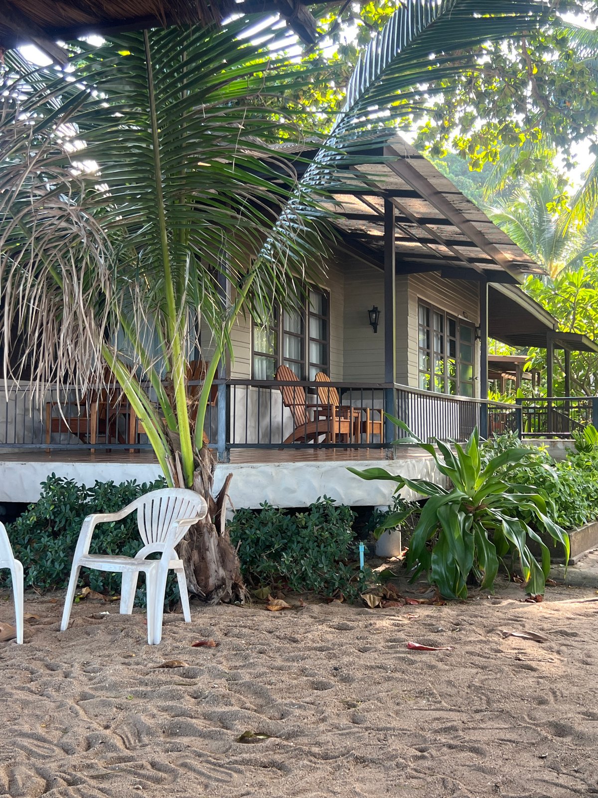 Lazy beach morning with jewelry, books, and bungalow views