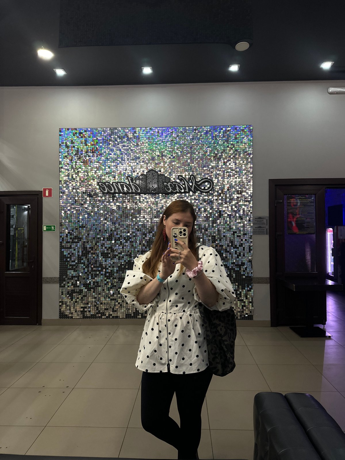 Selfies at a sequined wall inside a Petropavlovsk-Kamchatsky venue