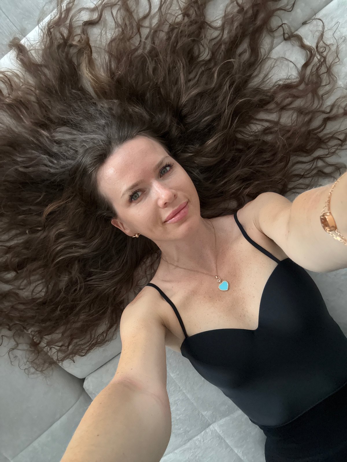 Overhead selfie with heart pendant, Moscow summer 2026