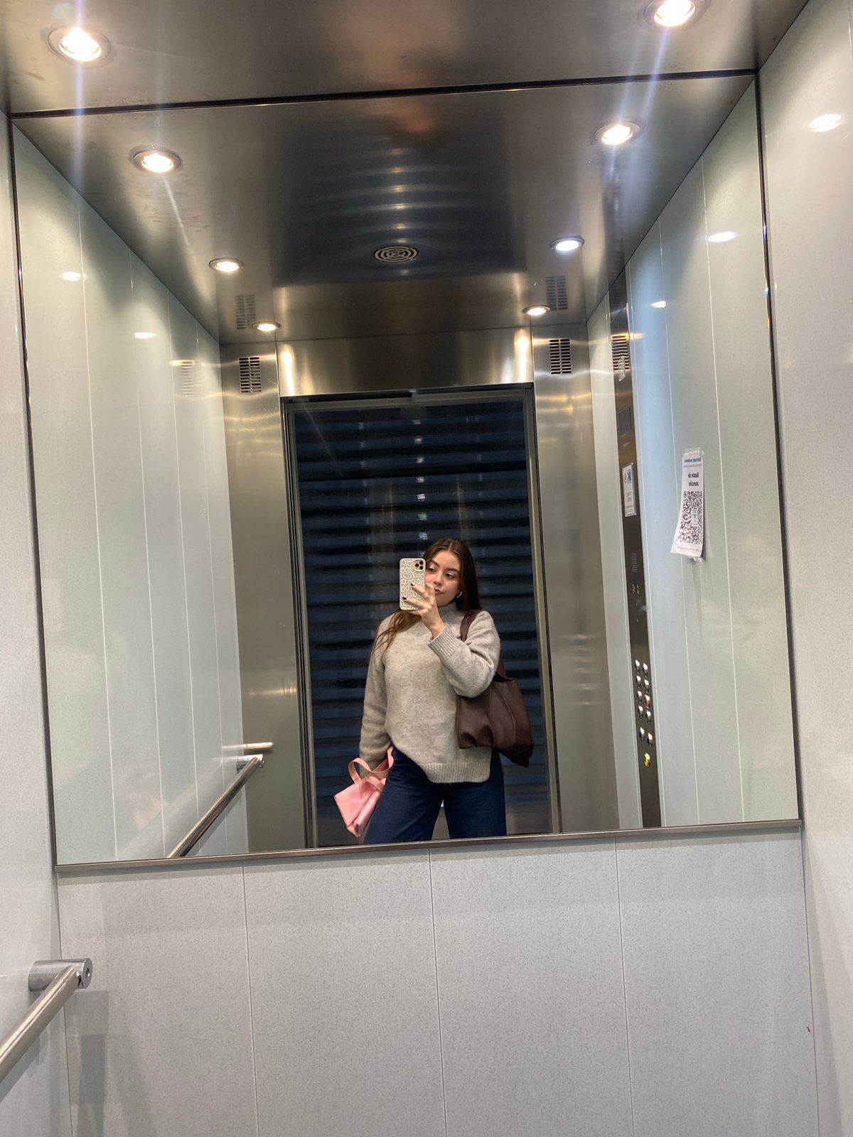 Woman takes elevator selfie in early morning hours