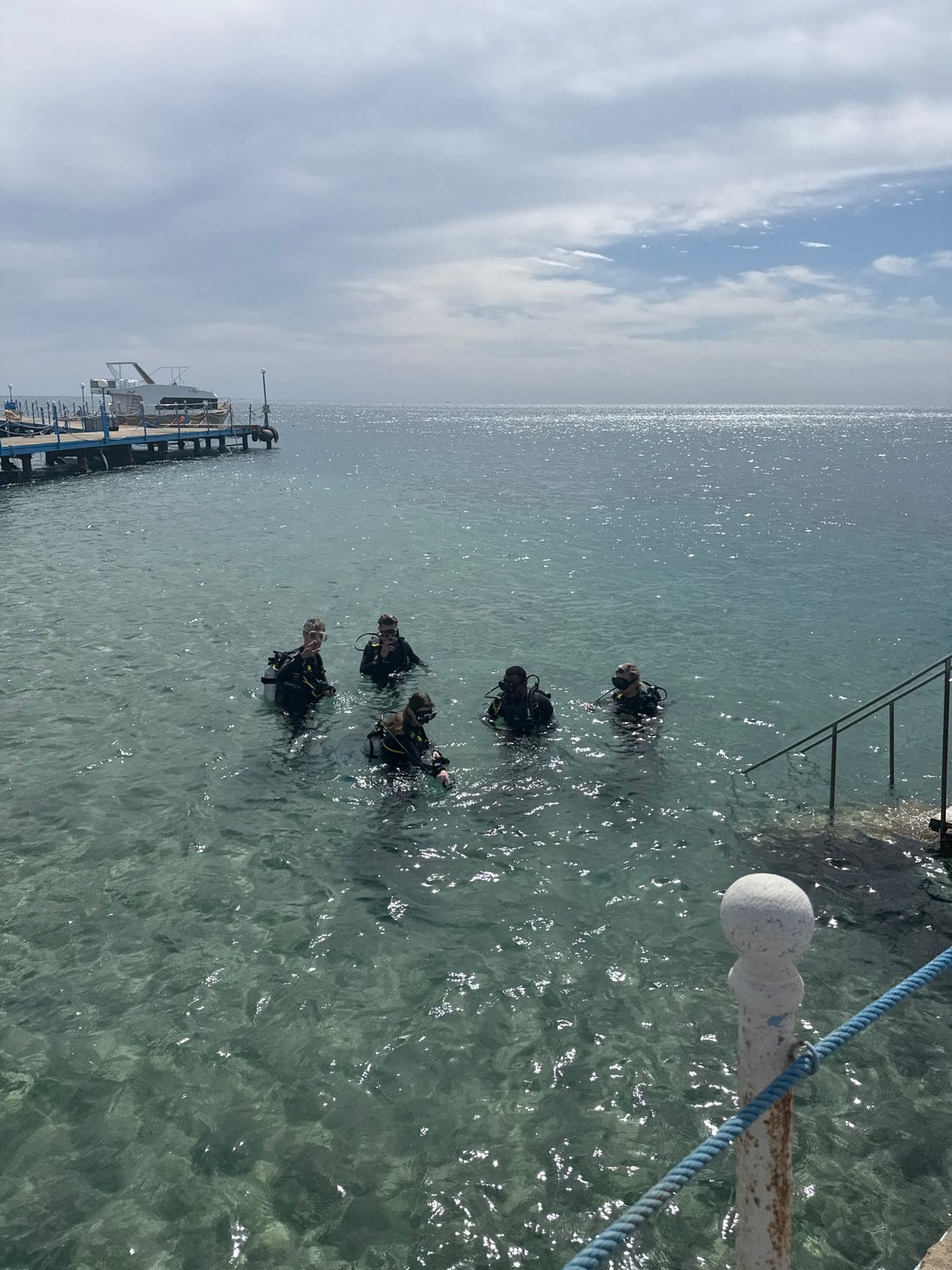 Divers prepare for underwater excursion near Safaga pier