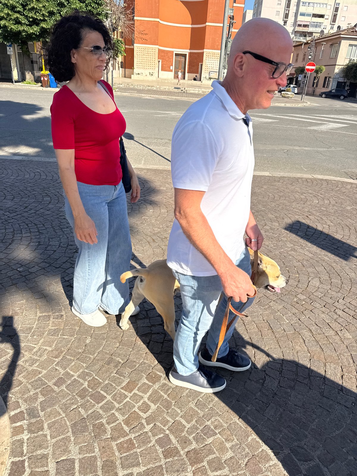 Ordinary afternoon street life unfolds in Aprilia, Italy