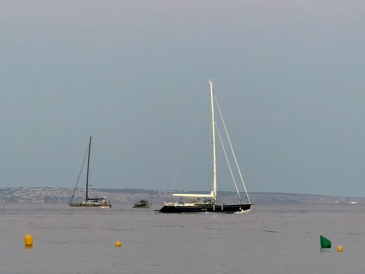 Mallorca afternoon: sailboats, beach at dusk, cocktails