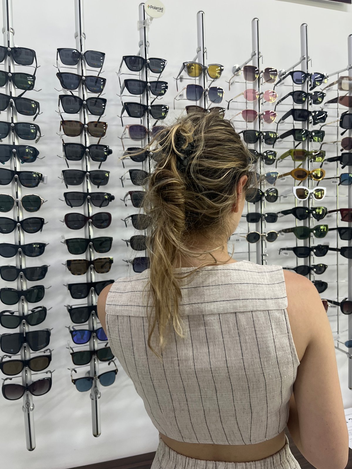 Shopper browses clothing and accessories in Blagoevgrad retail store