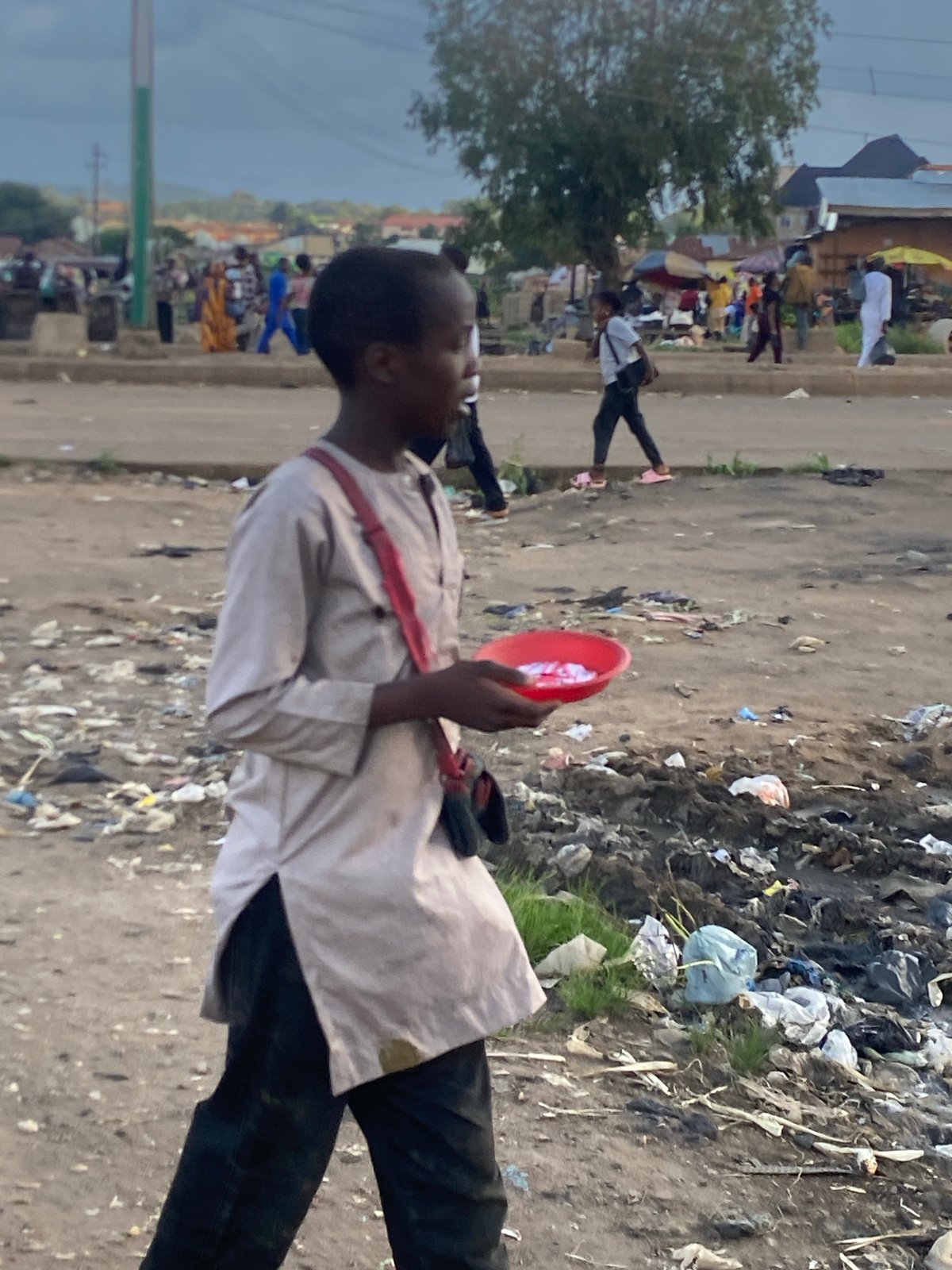 Street food and trade moving through Bukuru, Nigeria