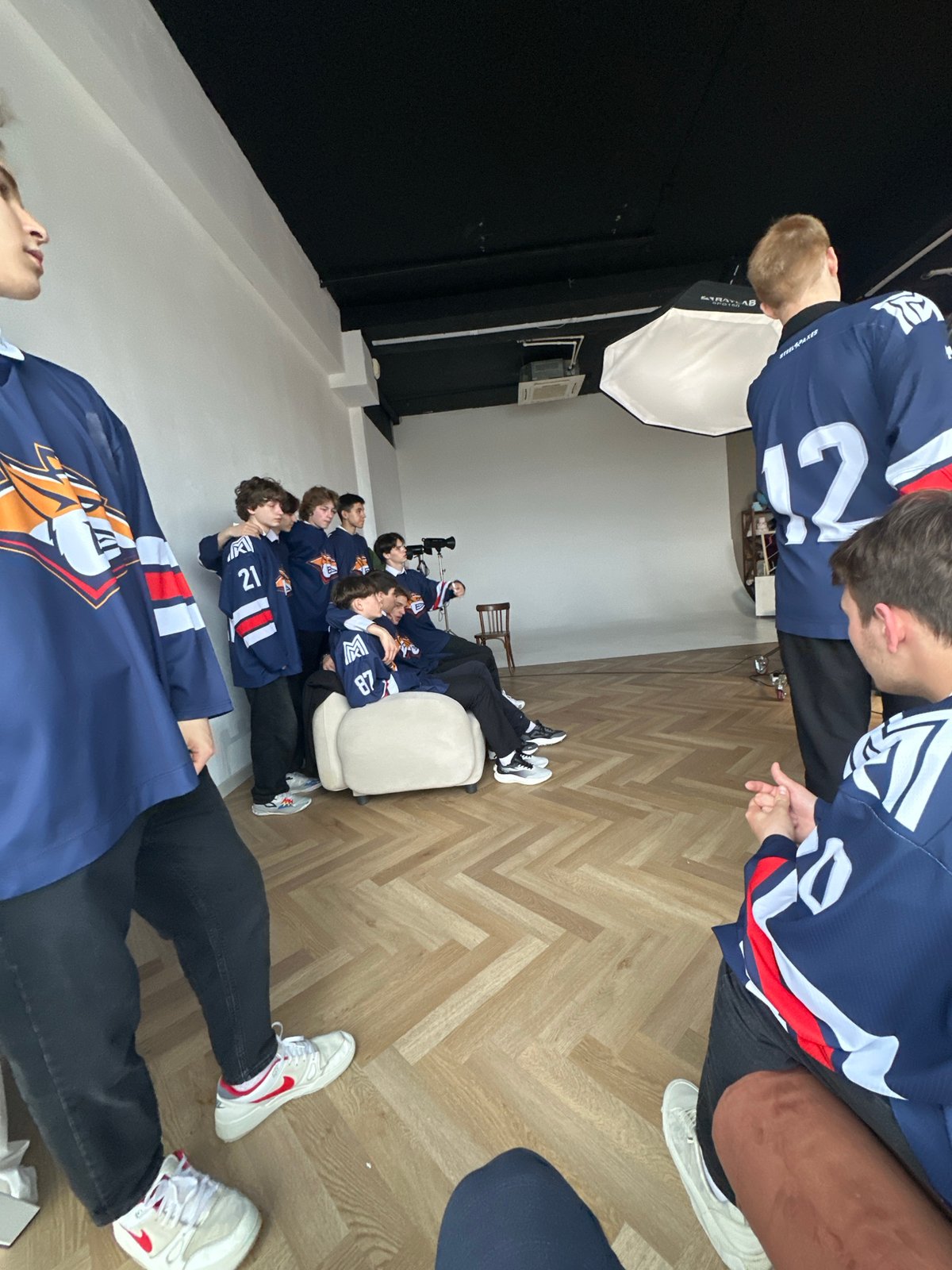 Hockey team photo shoot captured in studio setting