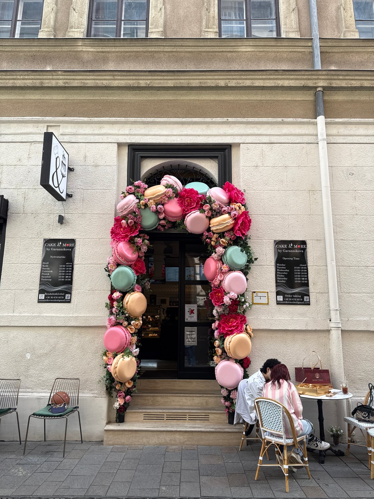 Scooter rider documents Budapest storefronts and architecture