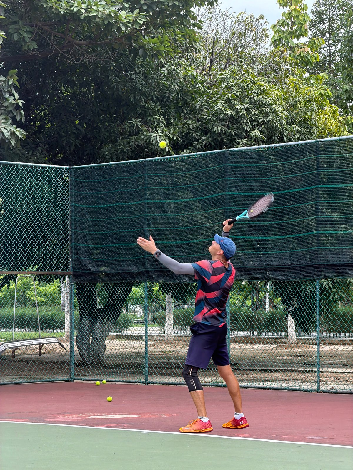 Tennis player observed in action at Nha Trang court