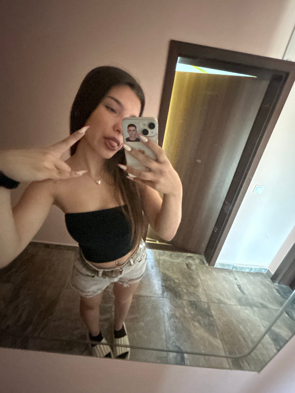 Hotel room selfies and a playful cat in Shumen