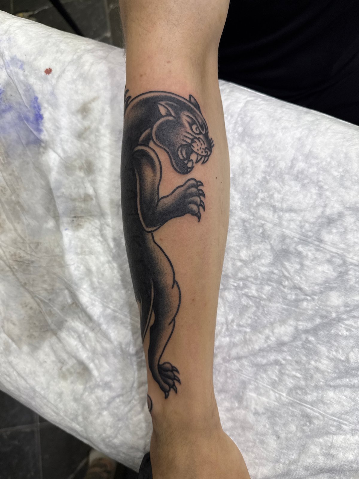 Black panther and gauntlet tattoos inked in Moscow