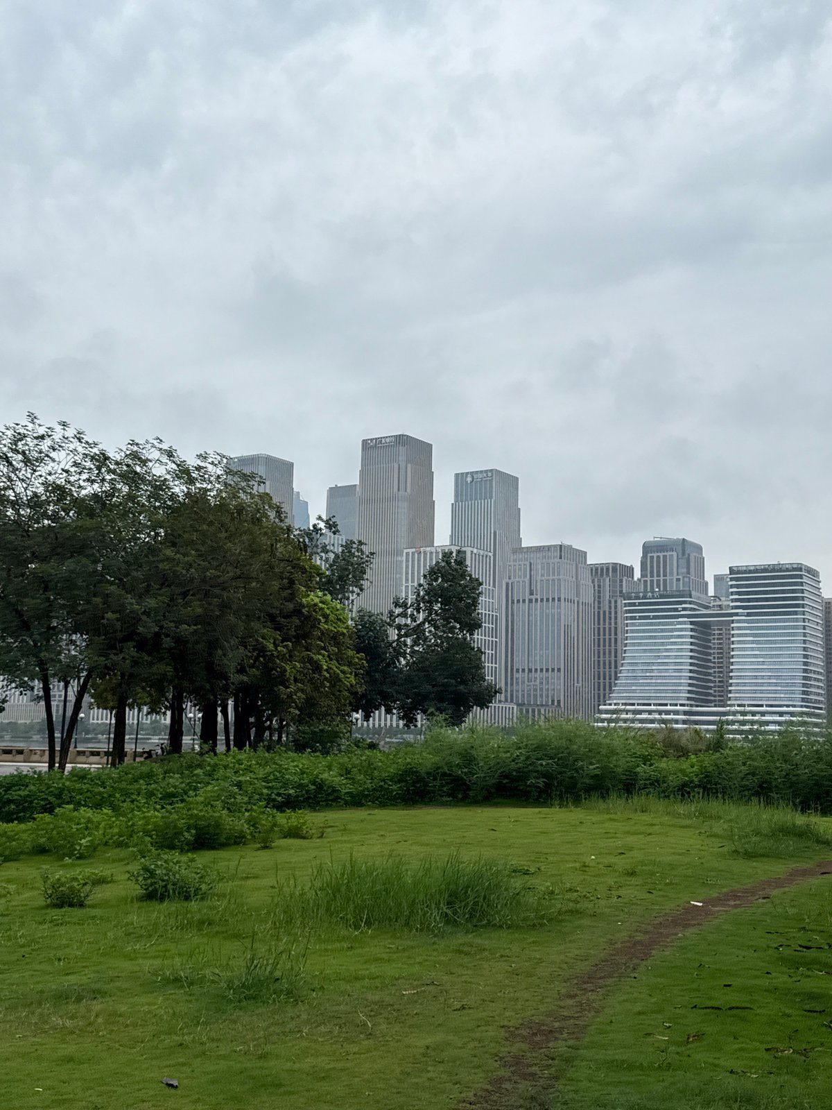 Riverside park life in Guangzhou's Tianhe District skyline