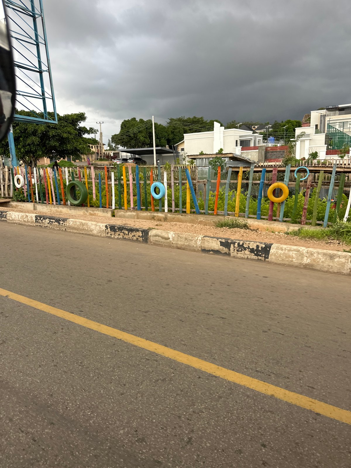 Street-level views through Jos, Nigeria on a cloudy afternoon