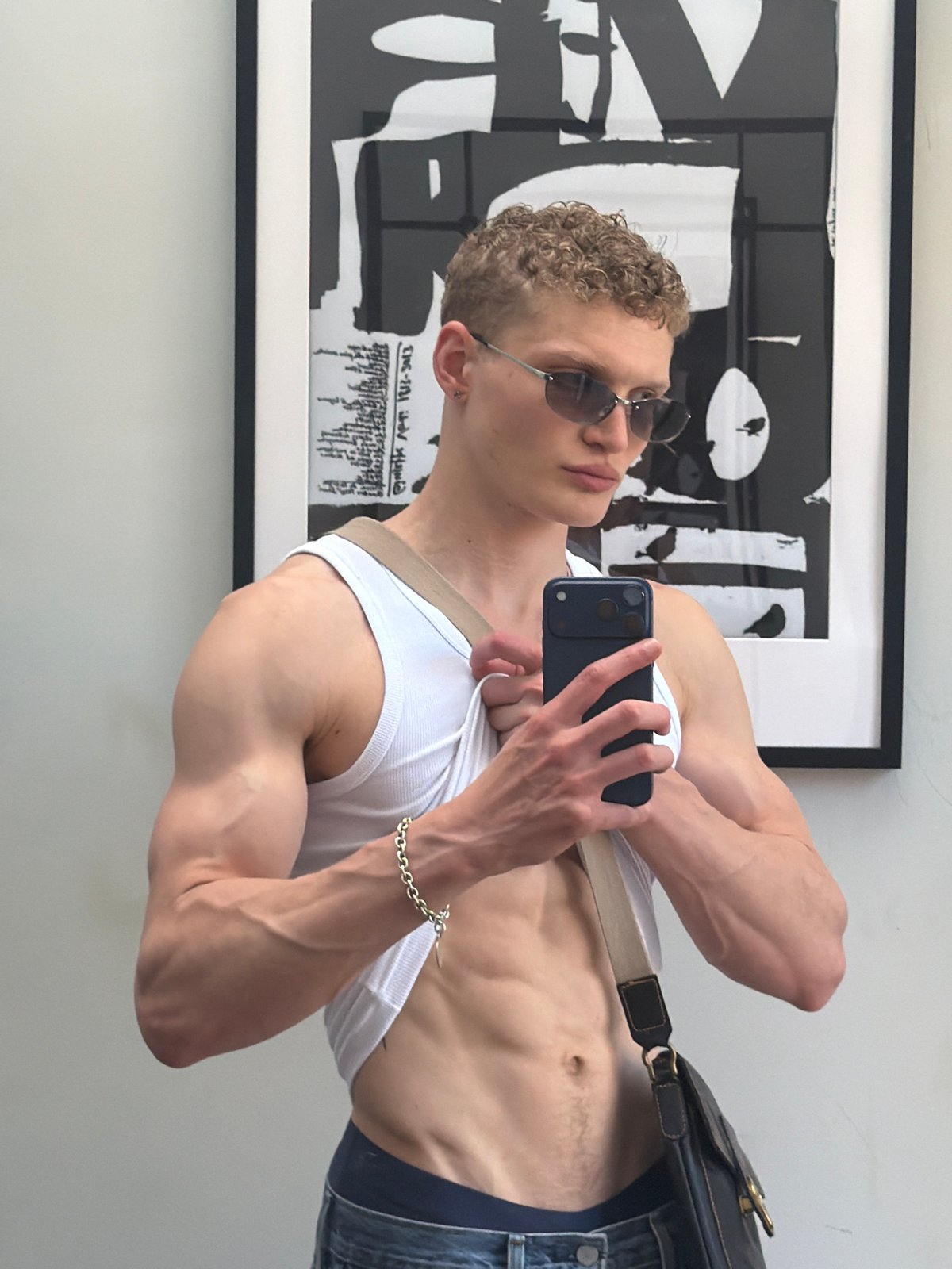 Young man takes multiple mirror selfies in London