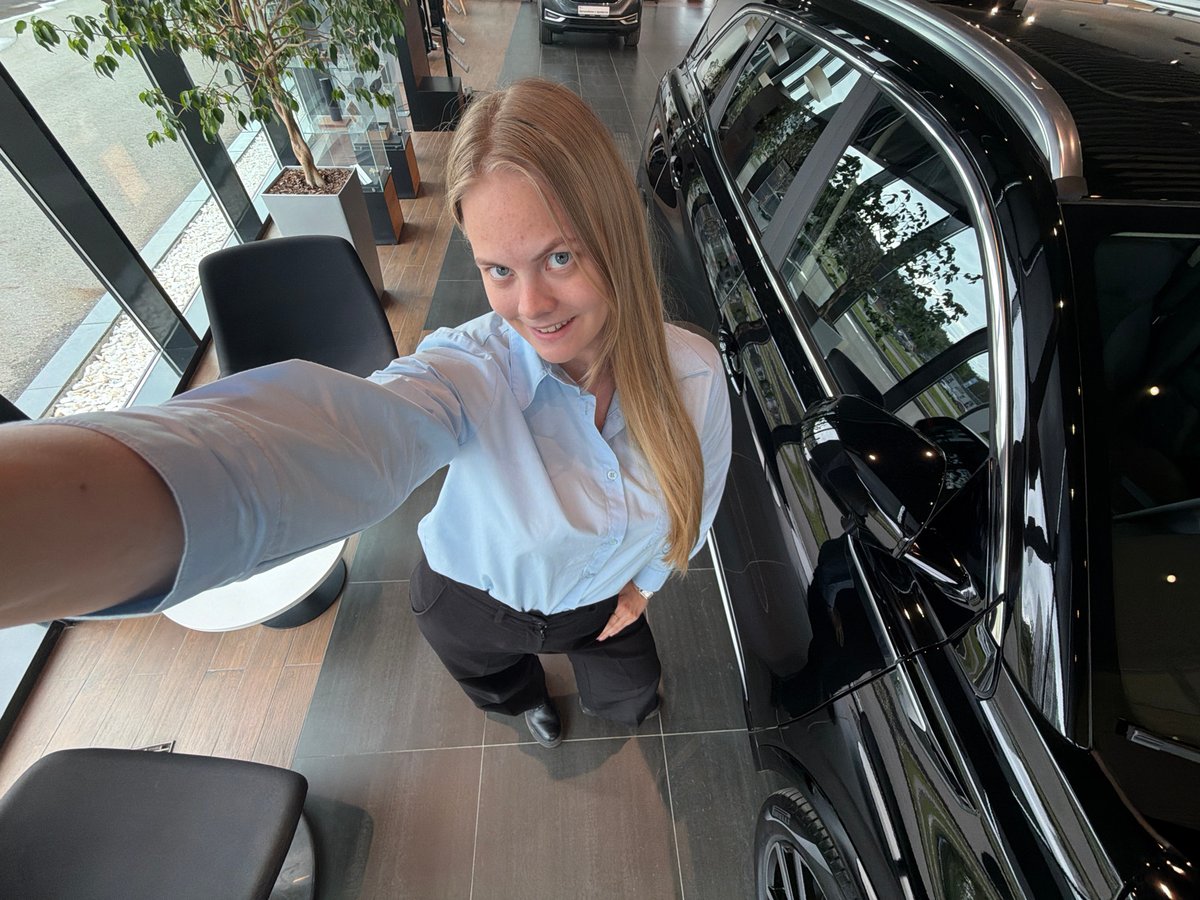 Woman takes selfies in modern building in Izhevsk
