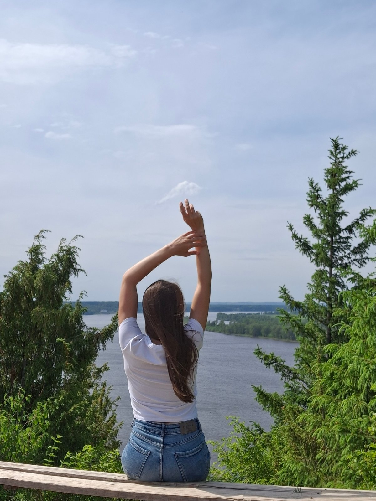 Woman spends morning observing river town life in Ольховка, Russia