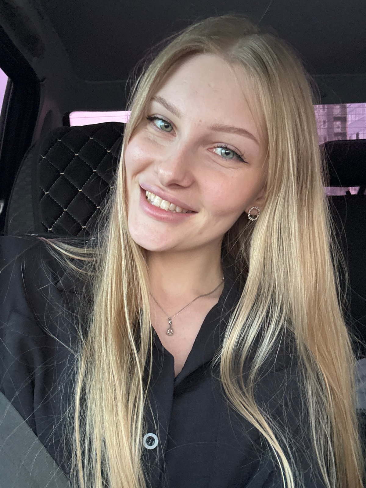 Young blonde woman photographed in car, Кондратово Russia