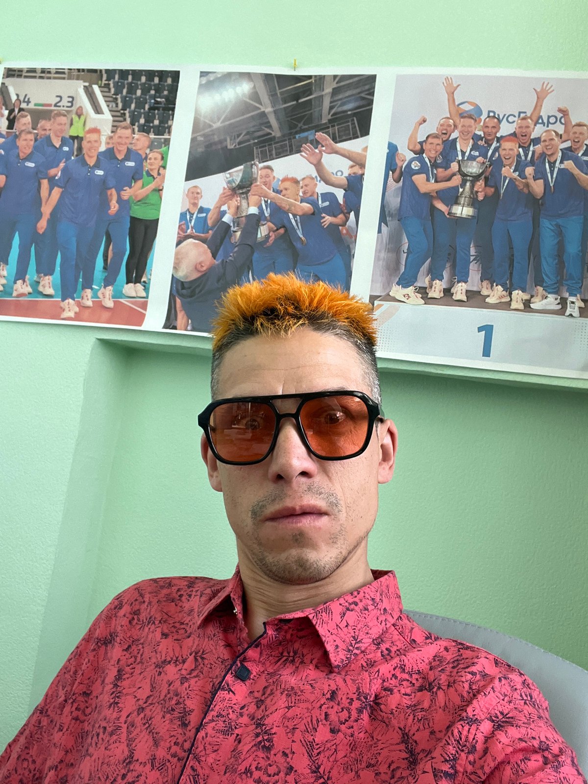 Orange-haired person photographed multiple times indoors in Chaikovsky, Russia