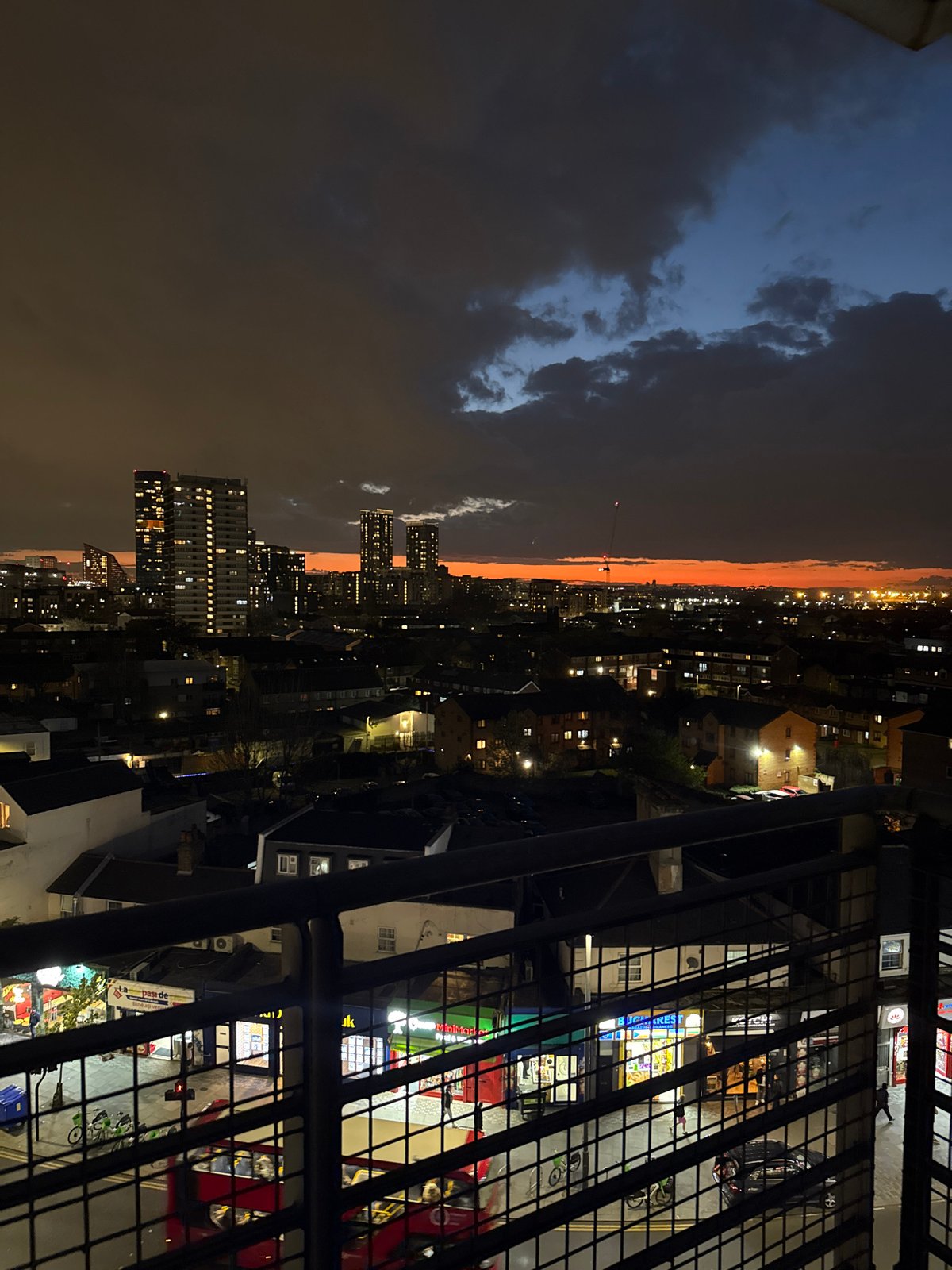 London skyline photographed from high-rise balcony at dusk