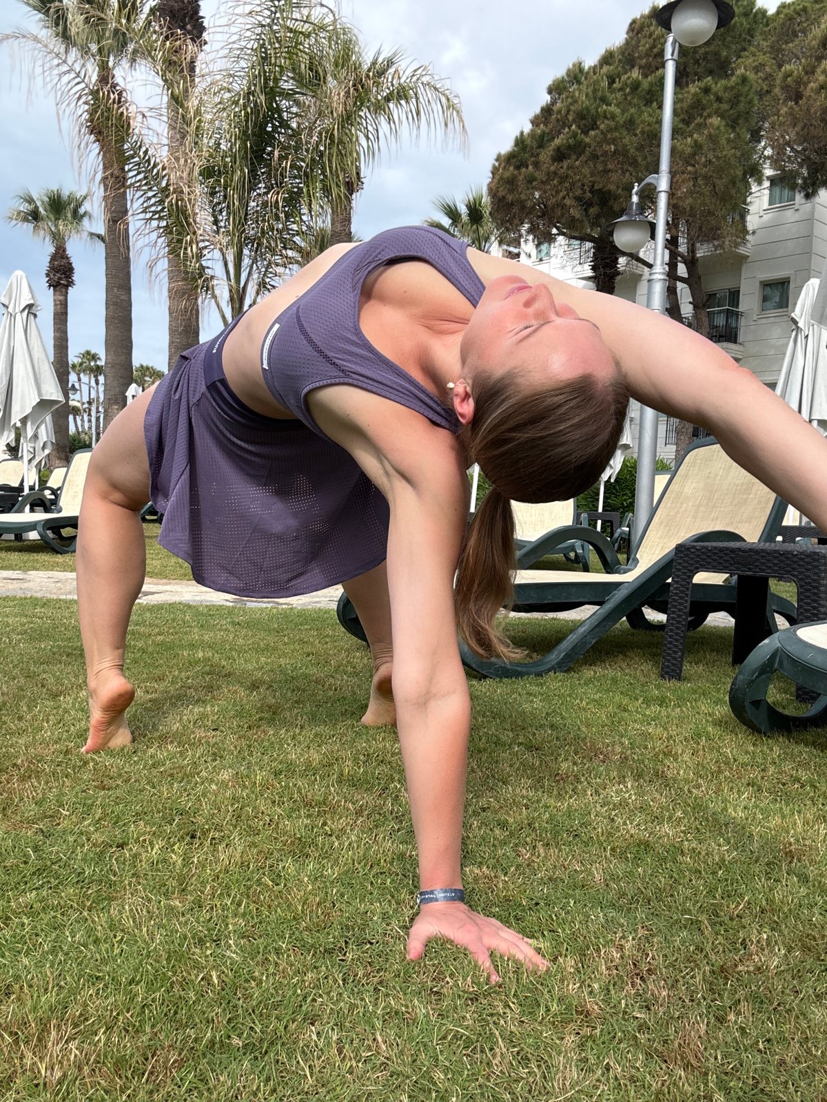 Morning yoga session at Turkish resort captured alongside tropical bird