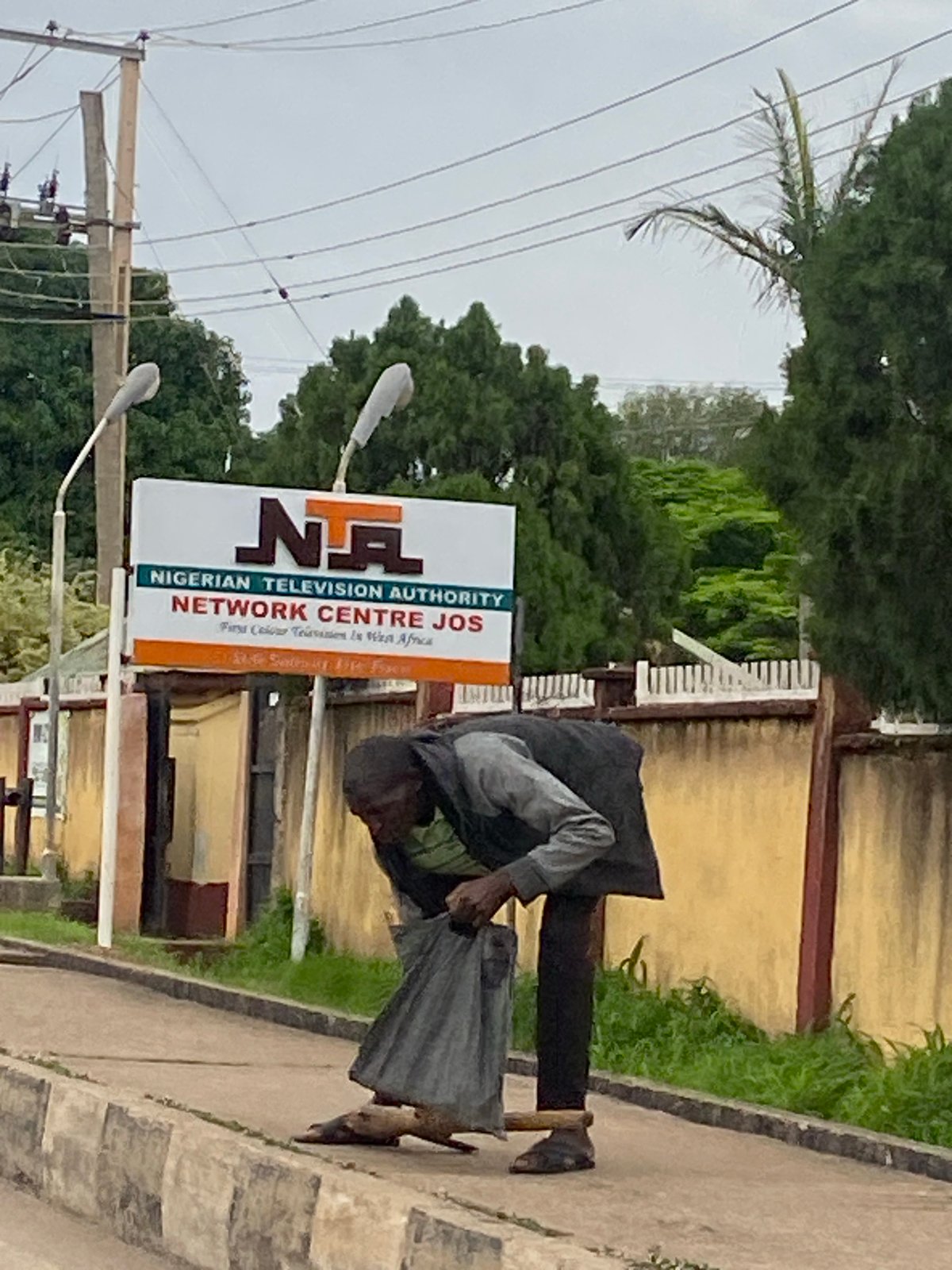 Street life and quiet interiors across a Jos afternoon
