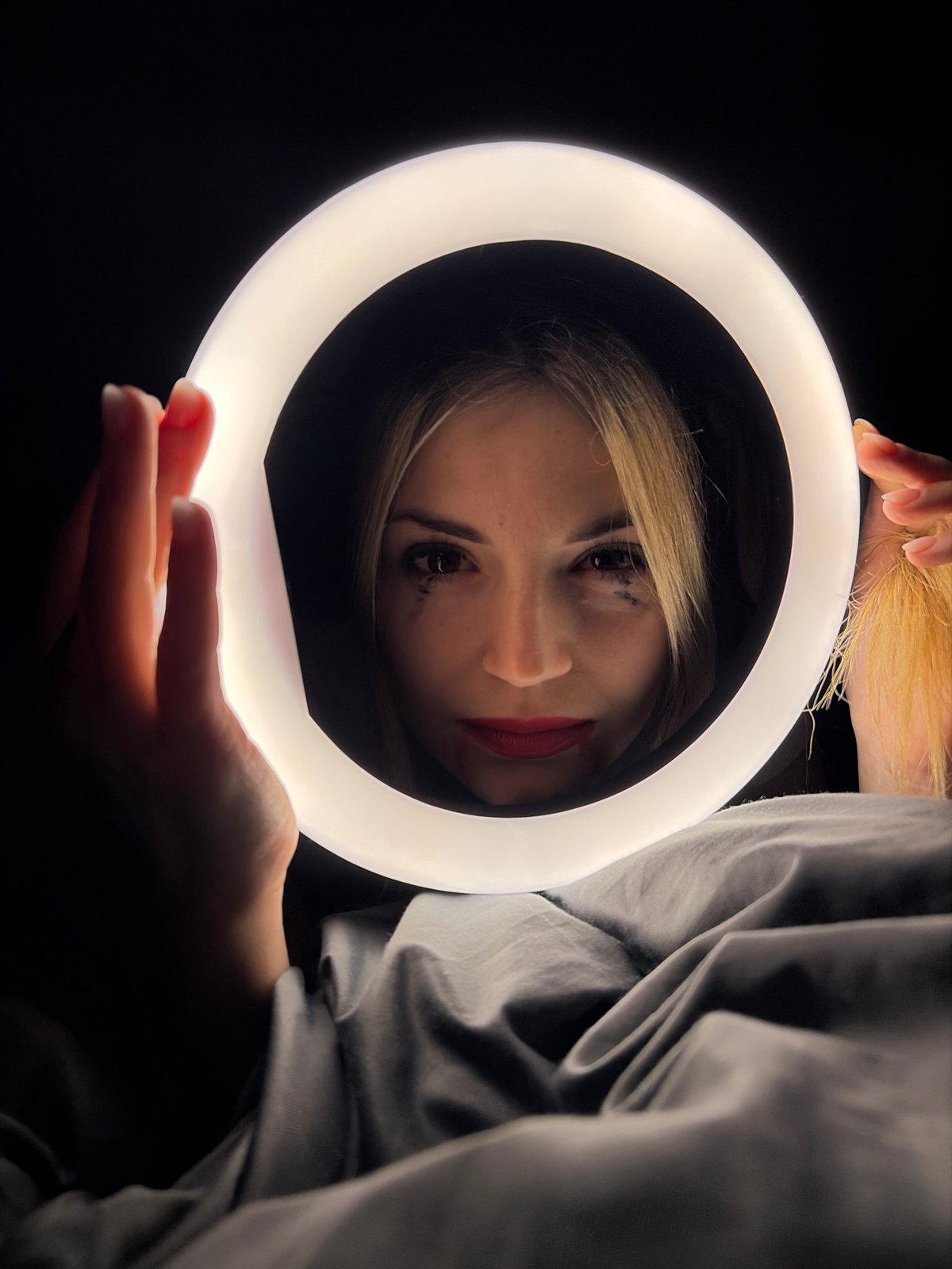 Woman uses ring light for content creation in Budva