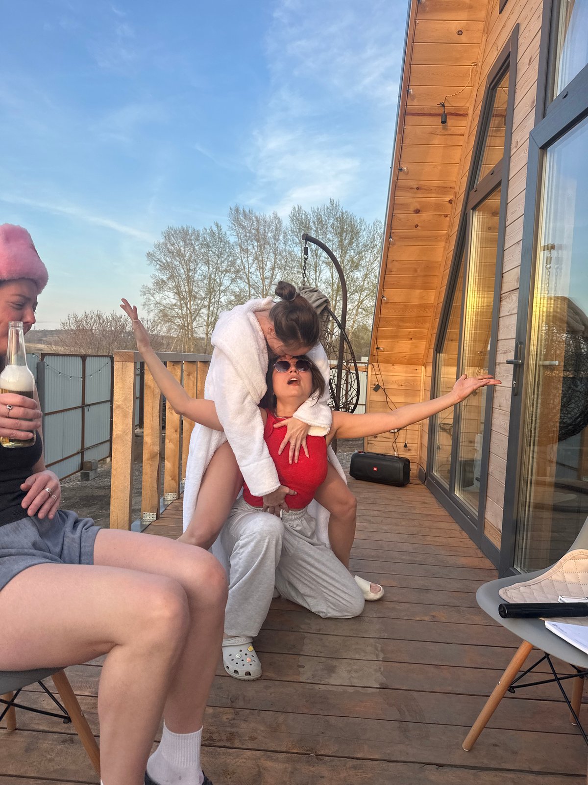 Young women gather, dance on wooden deck in Krasnoyarsk