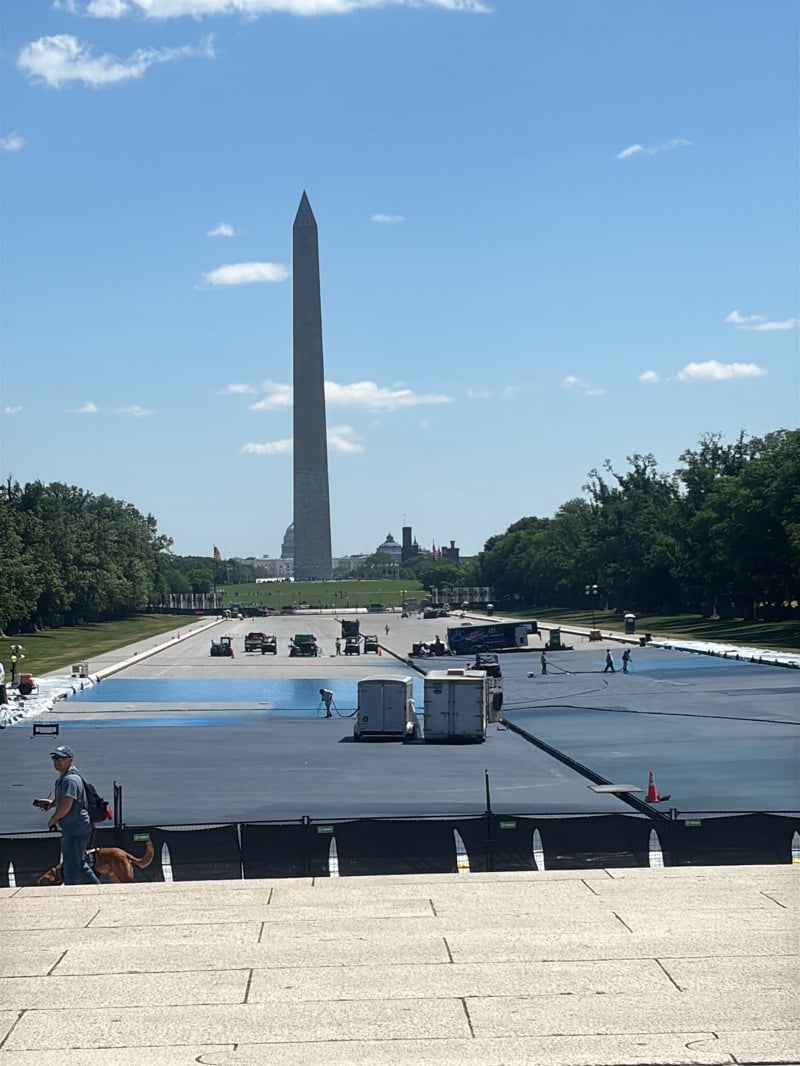 Workers Apply Blue Coating to National Mall Surface