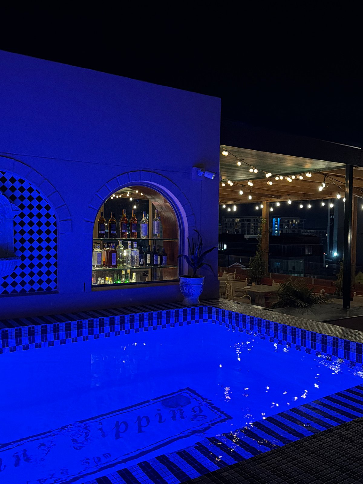Evening documented at Cape Town rooftop bar with pool