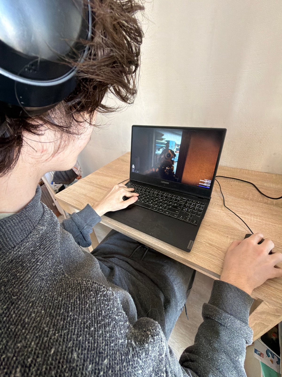 Gamer plays first-person shooter on laptop in Saint Petersburg