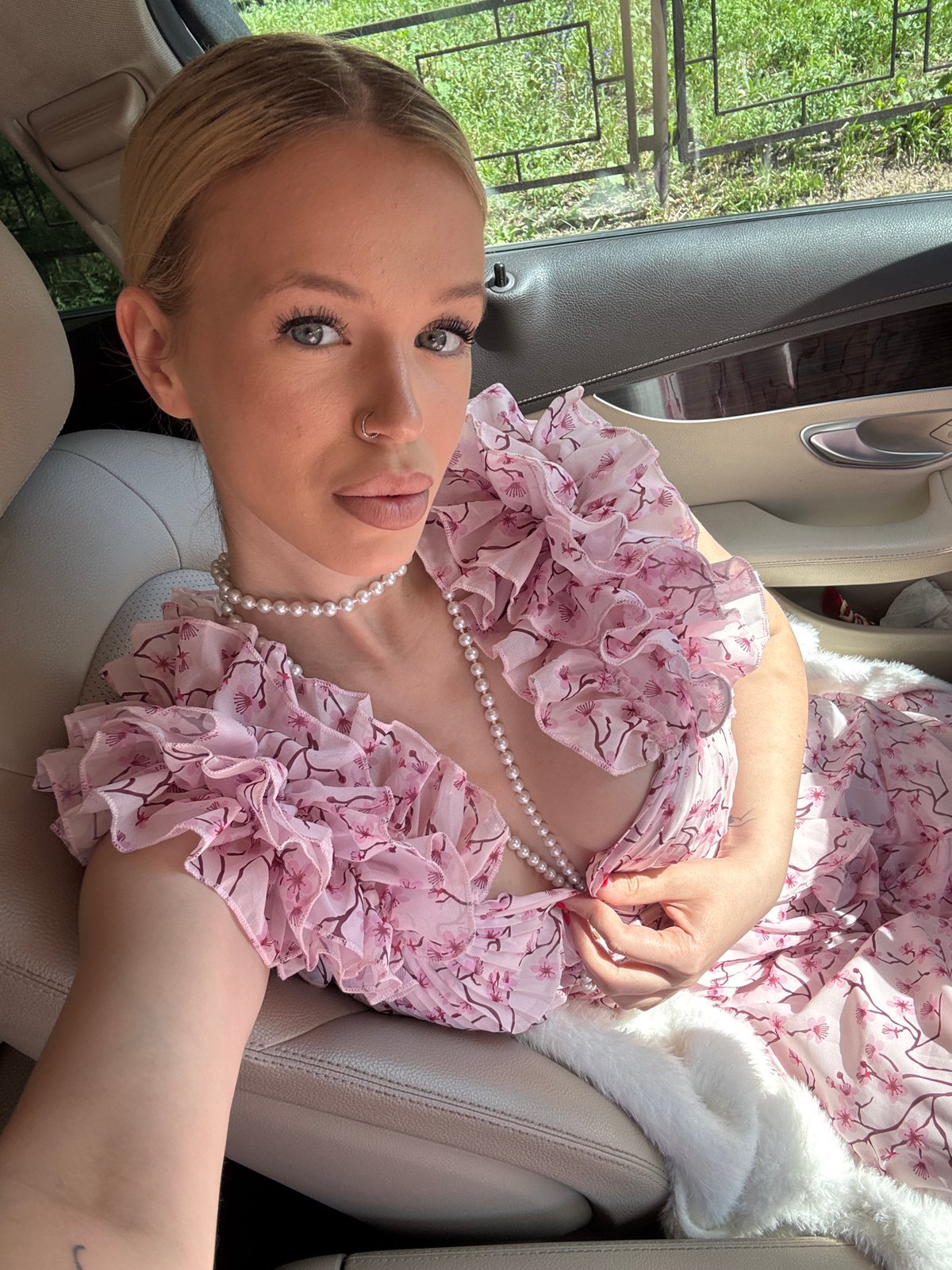 Dressed-up passenger selfie in a Saint Petersburg car