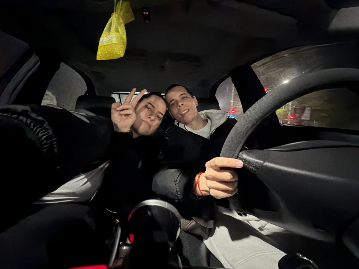 Two men in car during rainy evening in Plovdiv