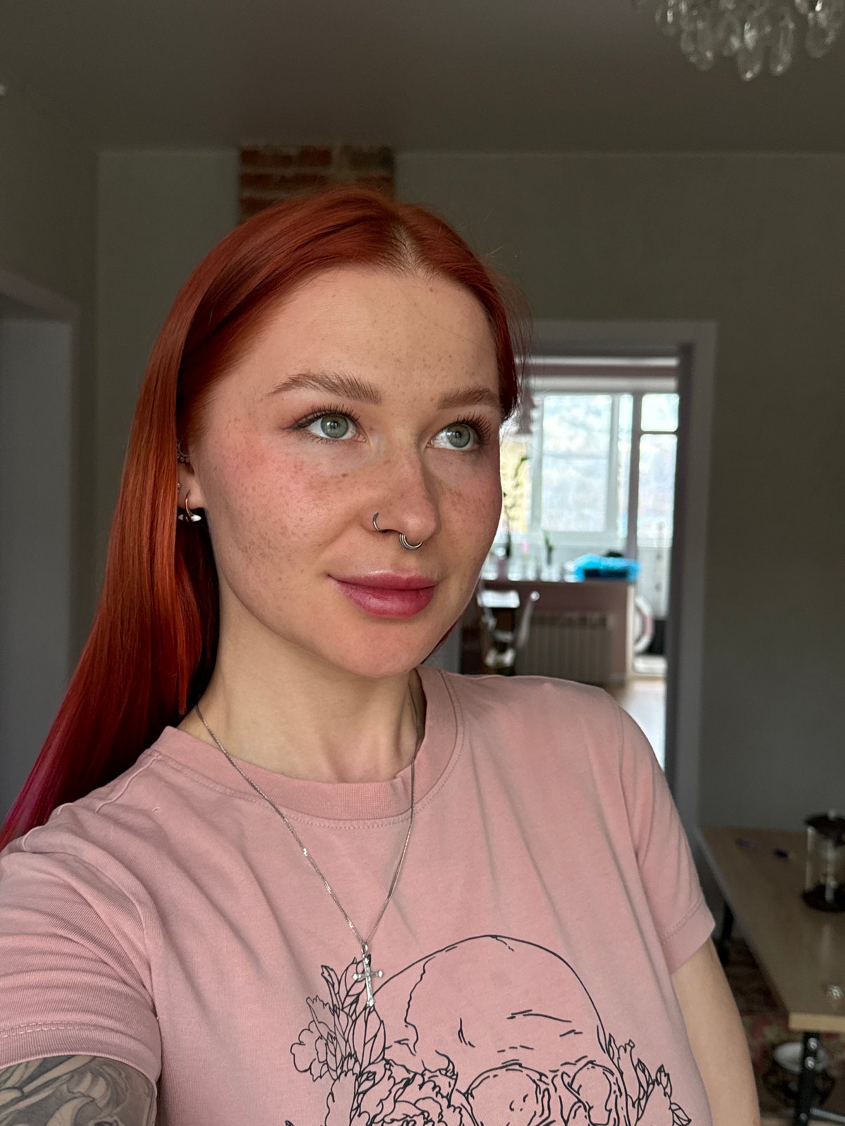 Red-haired woman takes selfie in Rostov-on-Don apartment