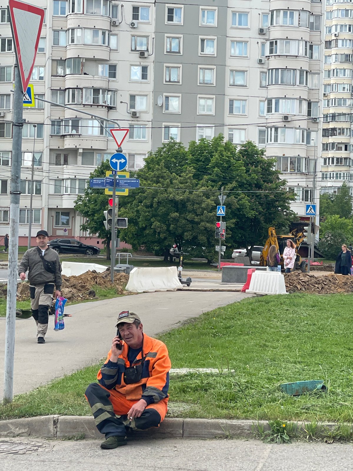 Construction work underway in Moscow with workers and machinery