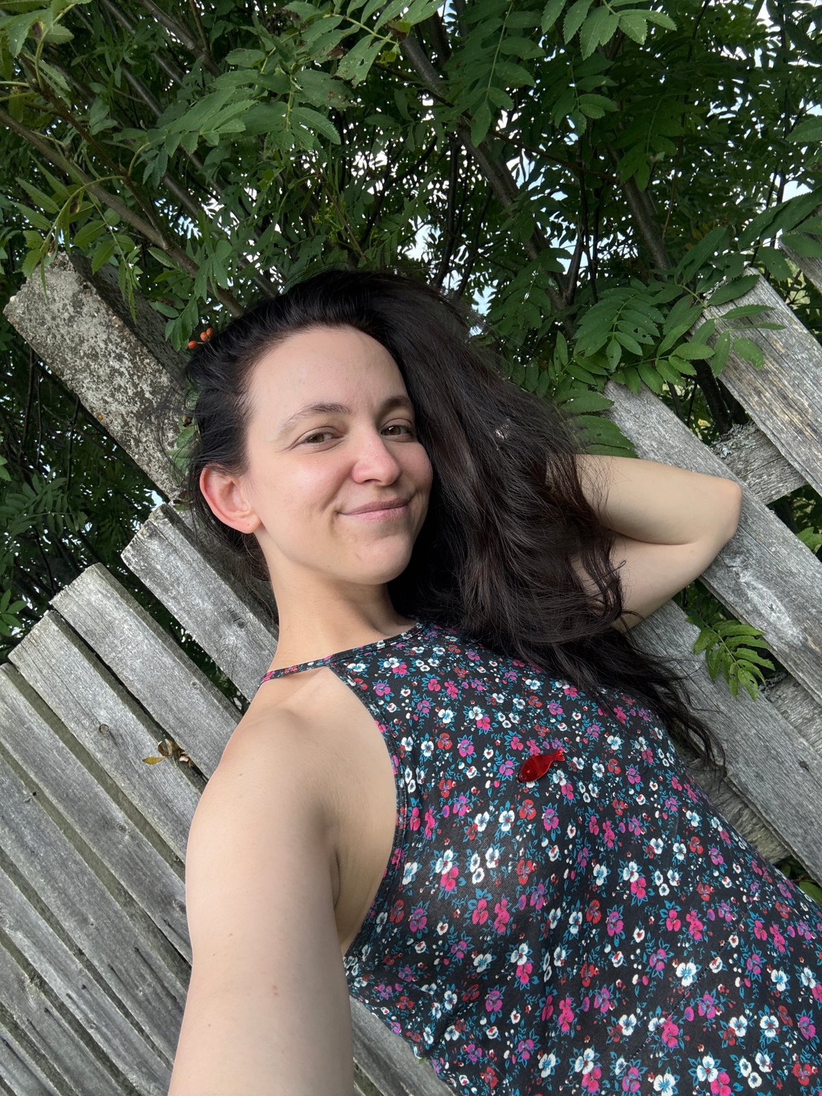 Lazy summer vibes: raspberries, a wooden fence, and a raft.
