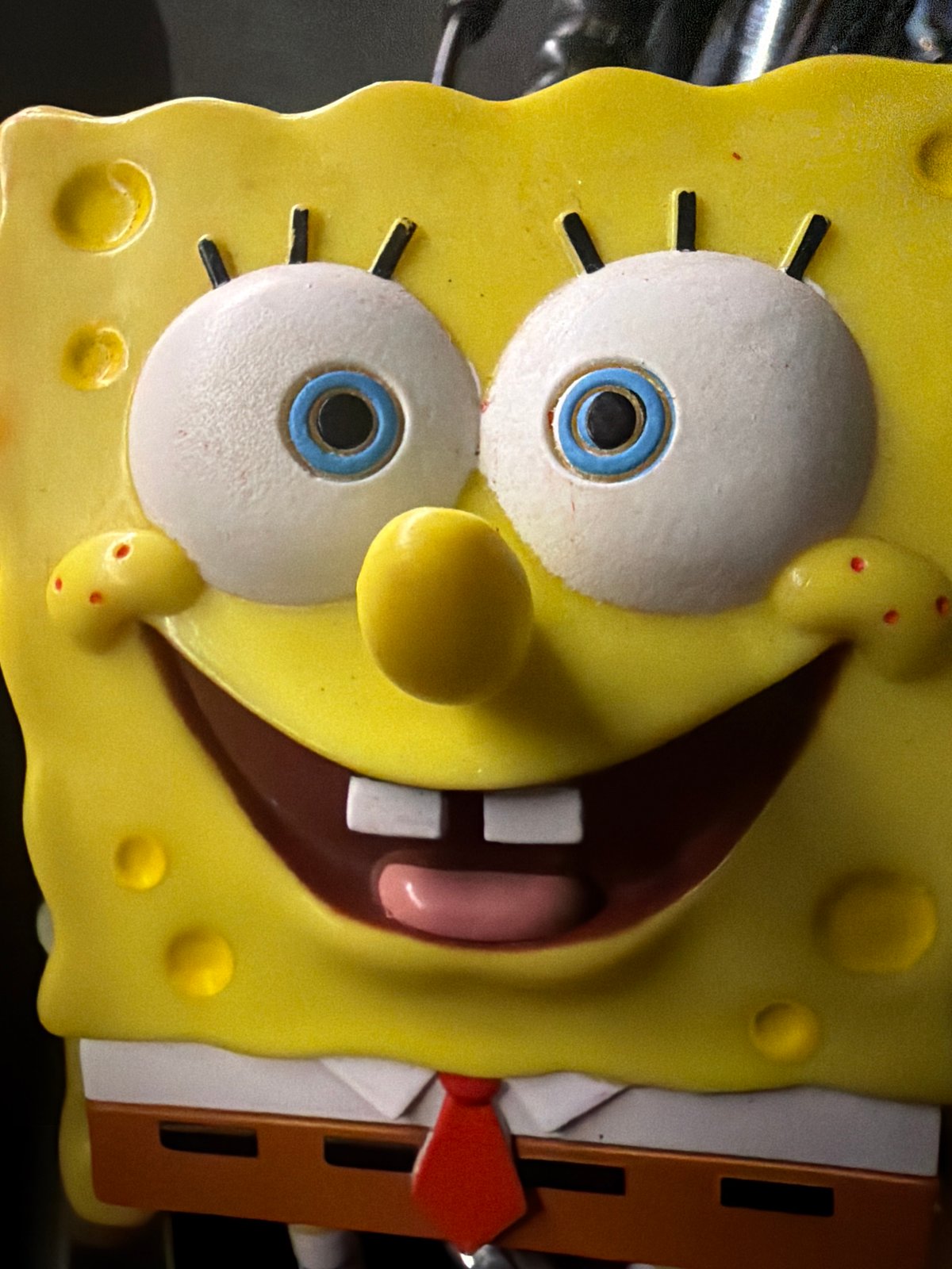 SpongeBob figurine posed and photographed on a motorcycle