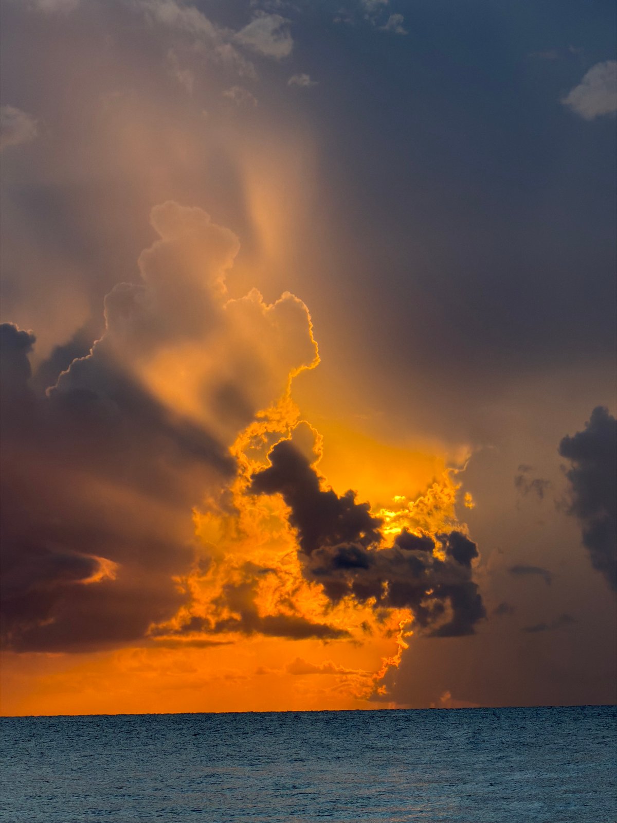 Storm clouds and golden light over Miami Beach at sunset