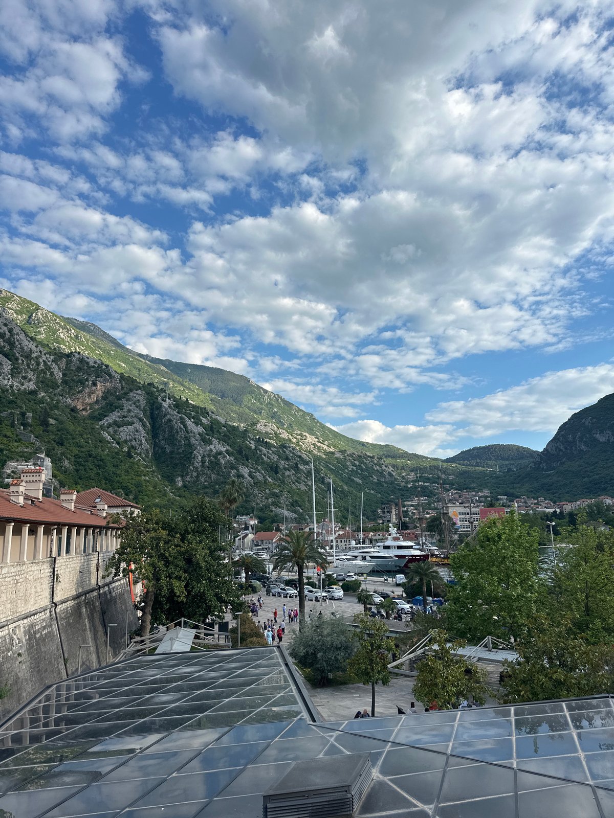Tourist documents scenic views of historic Kotor, Montenegro