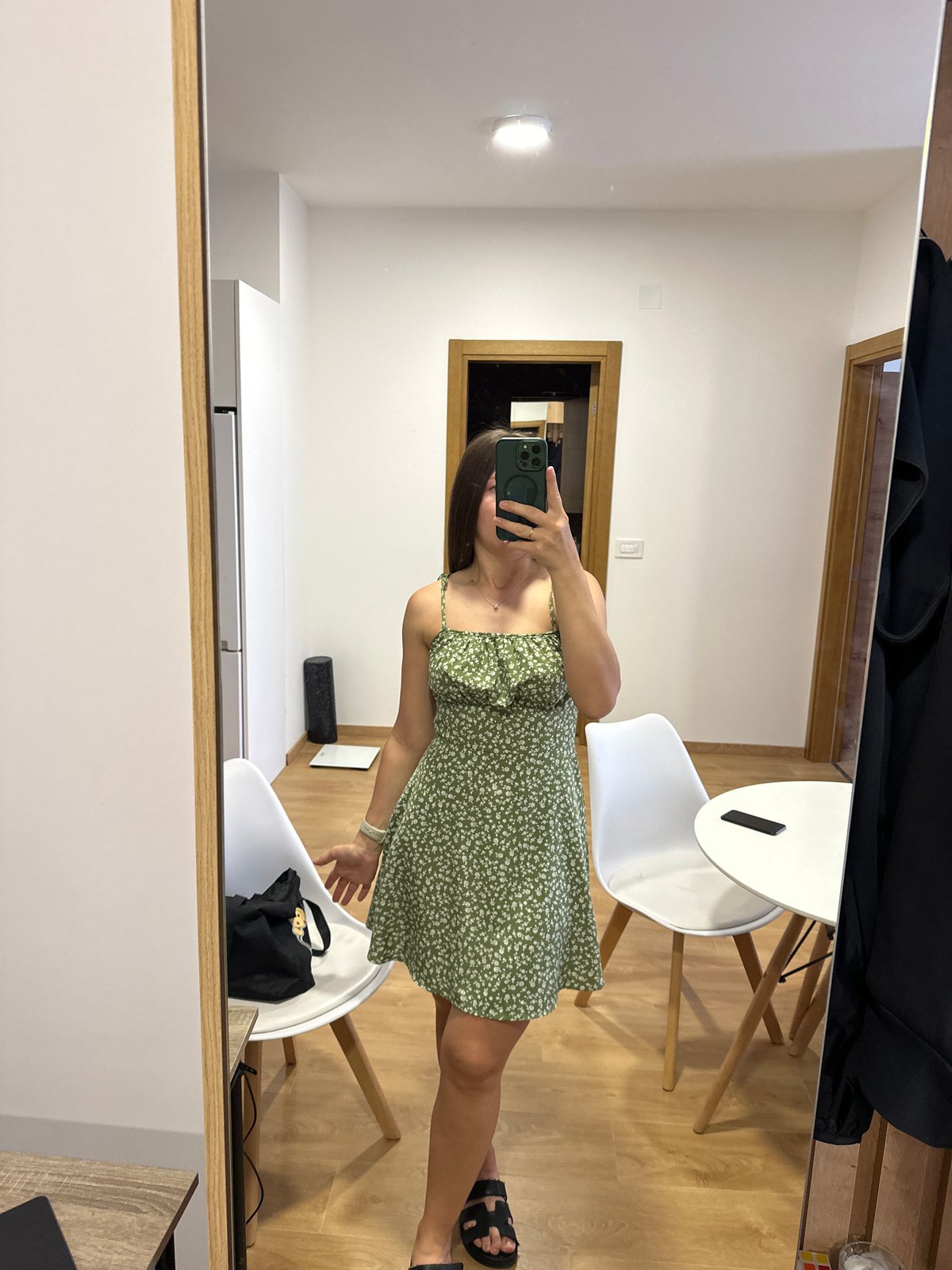 Woman takes mirror selfie in green dress, Montenegro