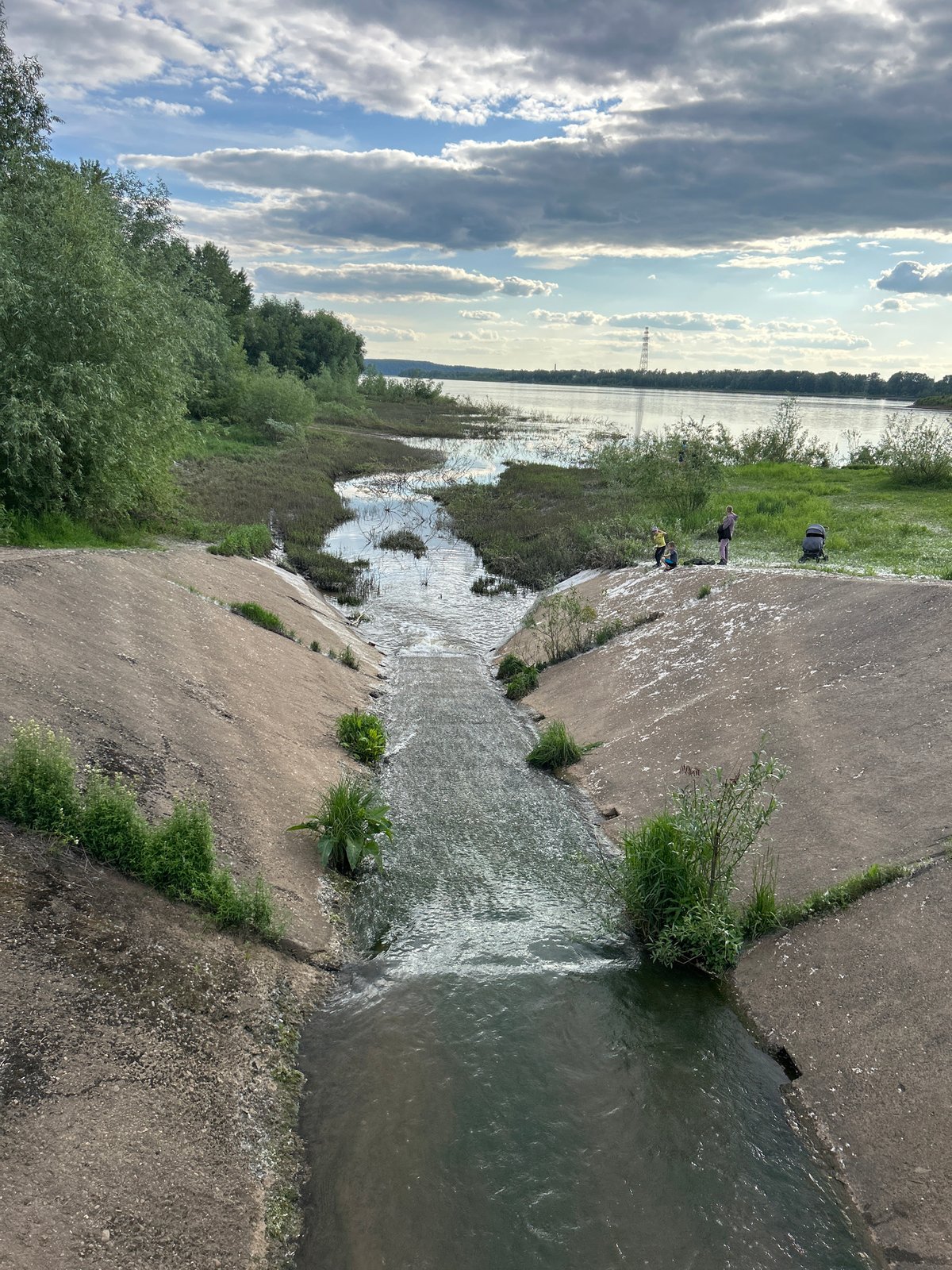 Riverside spring scenes documented in Chaikovsky, Russia with poplar fluff